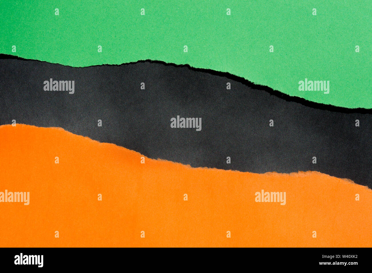 Bunte Papierreste Hintergrund Textur: orange, schwarz, grün Stockfoto