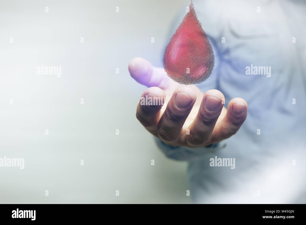 Die menschliche Hand. Weltblutspendetag. Mixed Media. Stockfoto