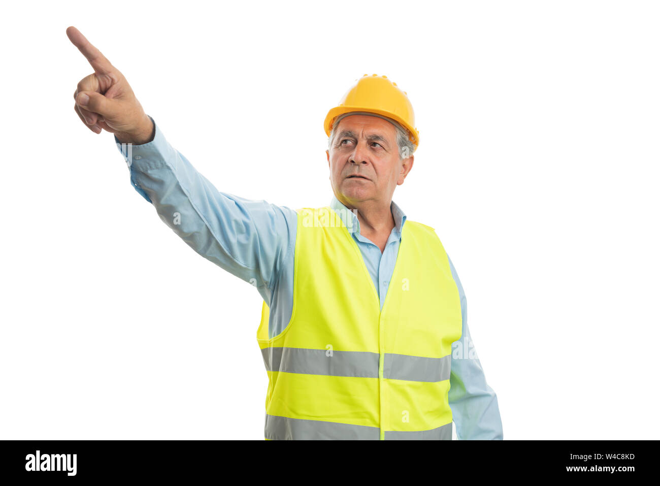 Alte builder Mann mit verärgerten Ausdruck, der Zeigefinger an der Kamera auf weißem studio Hintergrund isoliert Stockfoto