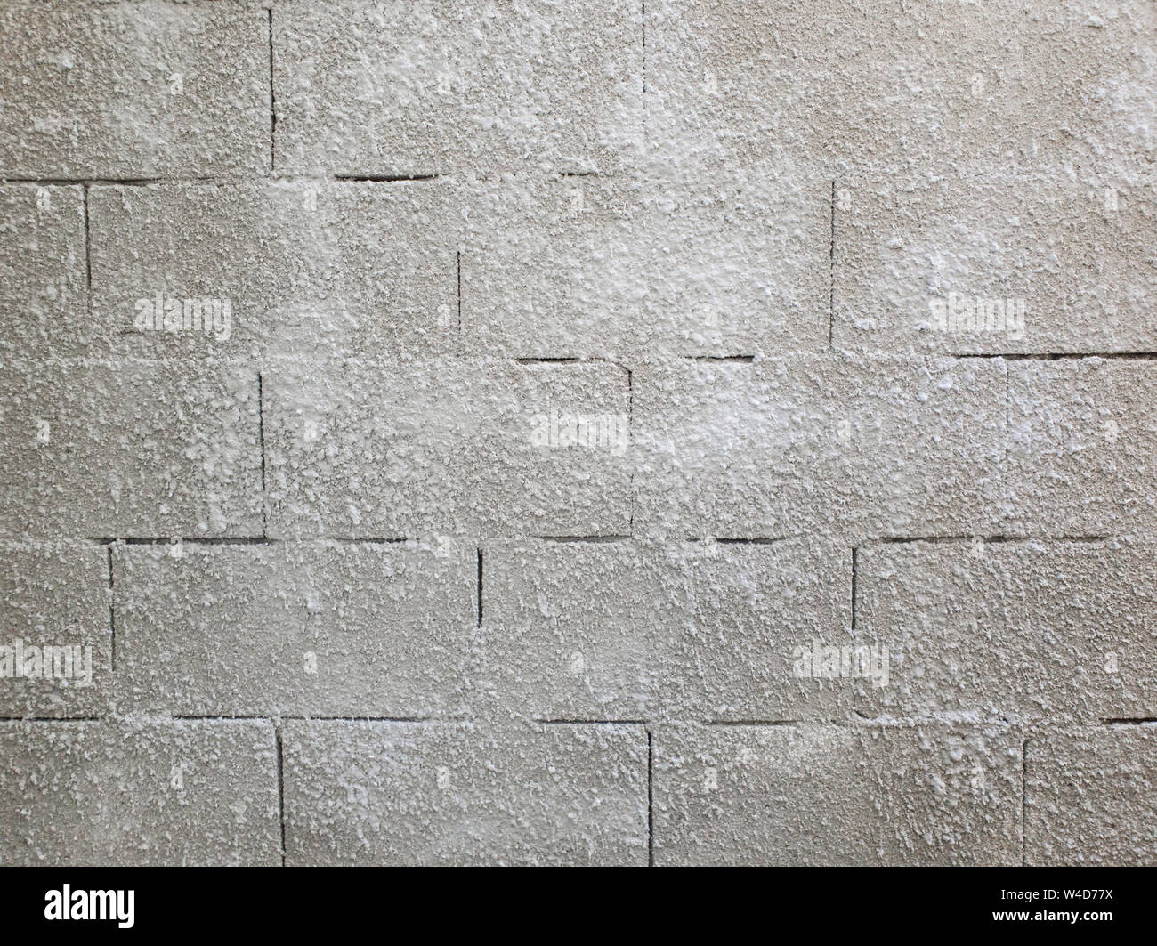 Alten grauen Stein gemauerte Wand Textur aus Schaumstoff Blöcke oder airblocks. Abstrakte Fläche verputzt. Grunge, verwitterte Baustruktur. Stockfoto