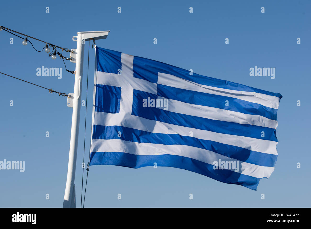 Griechische Fahne winken Stockfoto