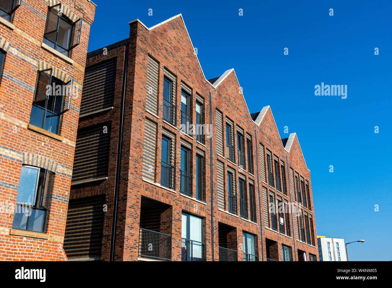 Die warehaus Entwicklung, Konvertieren eines frühen 20. Jahrhundert, plus 7 neue Häuser und 20 neue Wohnungen, Ancoats, Manchester, England, Großbritannien Stockfoto