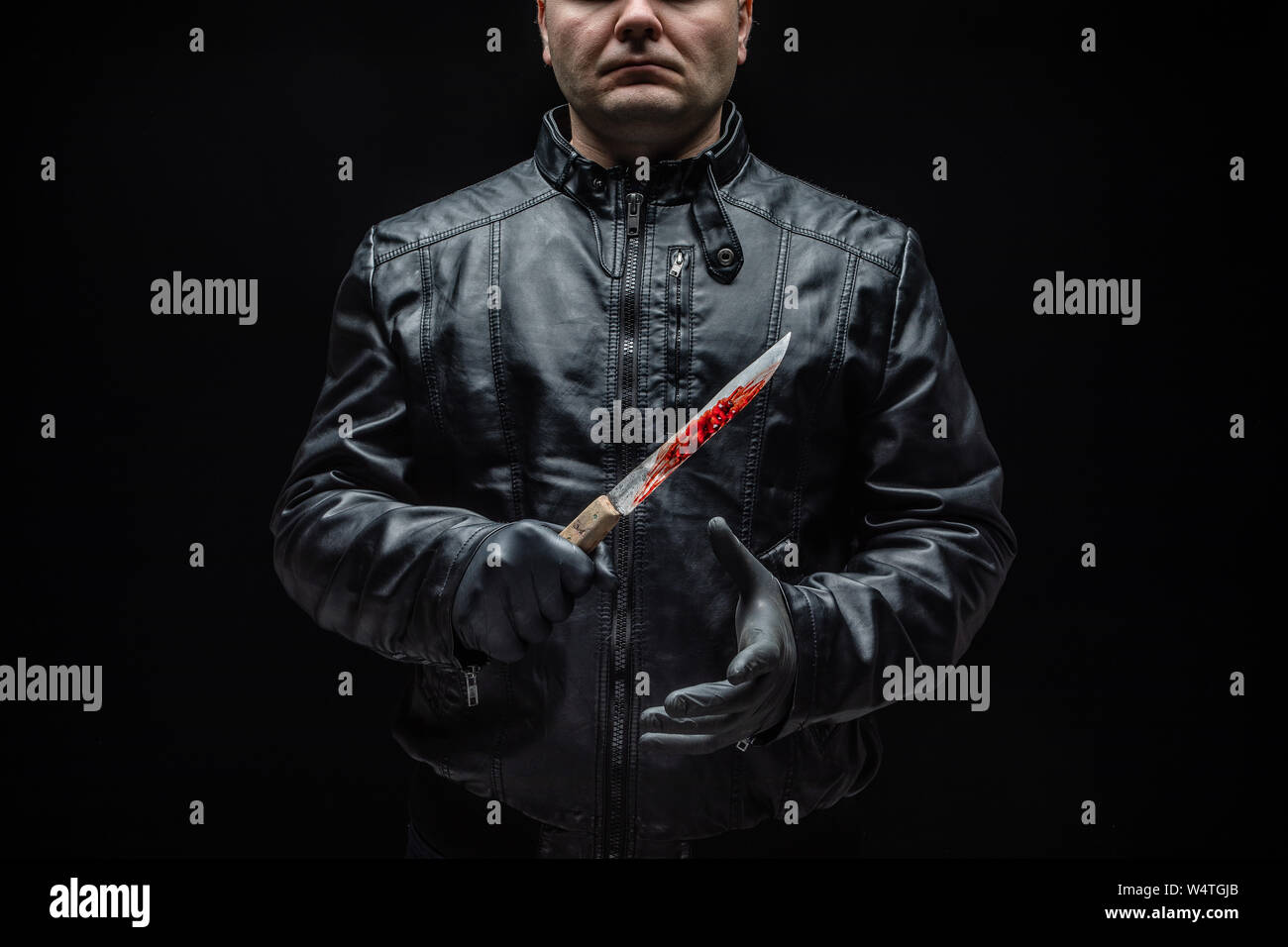 Serial Killer maniac mit Messer und schwarzen Handschuhen/killer Tools Stockfoto