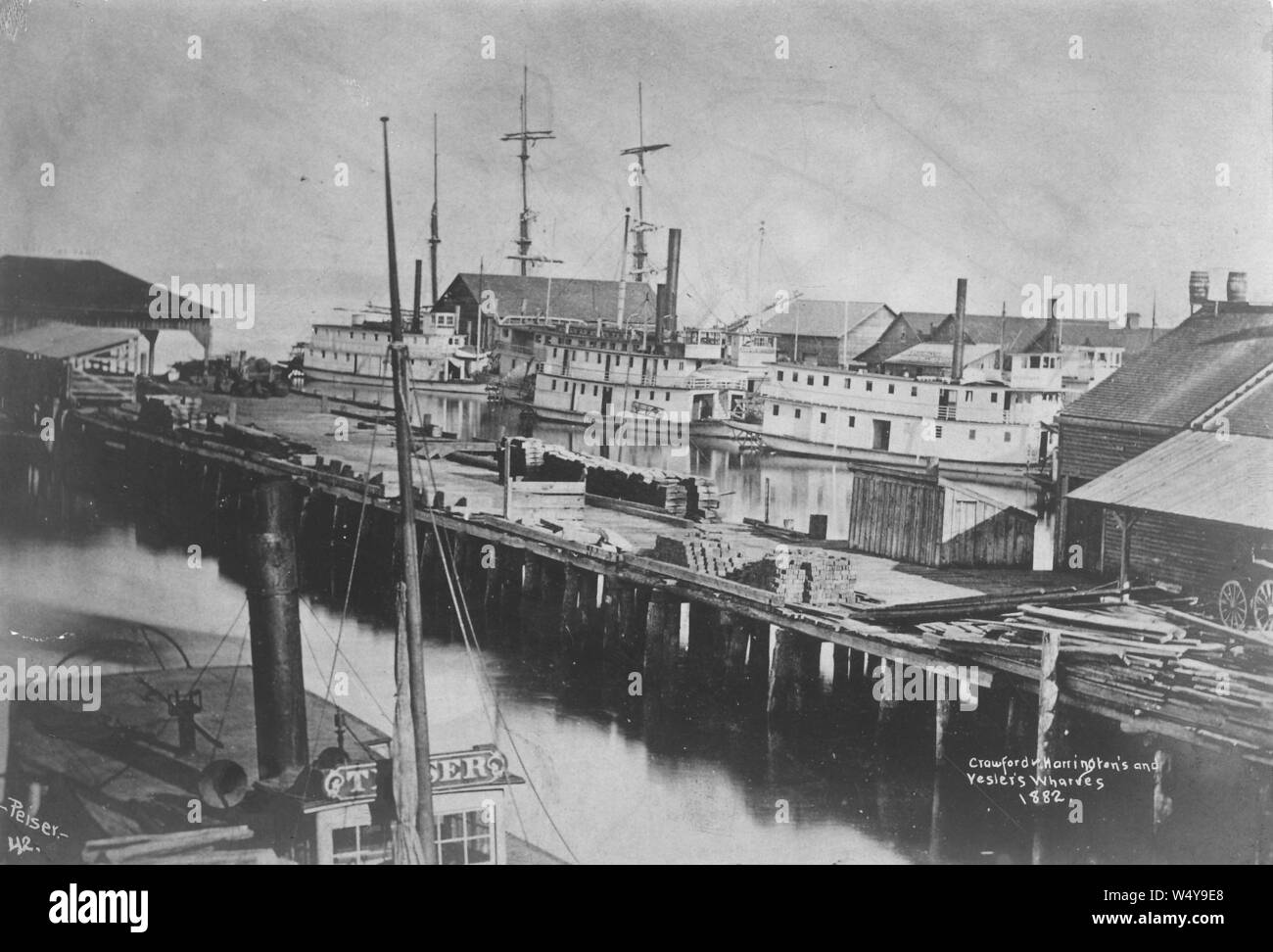 Crawford, Harrington und yesler von Liegeplätzen, auf der Suche nach Westen Richtung Elliott Bay, Seattle, 1882 (PEISER 143). Stockfoto