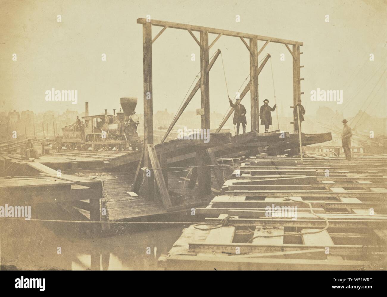 Weist die Oberfläche von ein paar Lastkähne, die den Titel für das Be- und Entladen von Fahrzeugen, außerdem die bewegliche Brücken, durch die die Spuren der Schwimmer mit denen auf dem Wharf verbunden sind, A.J. Russell (American, 1830-1902), Alexandria, Virginia, USA, März 1863, gesalzen Papier drucken, 15,2 × 20,1 cm (6 x 7 15/16 in Stockfoto