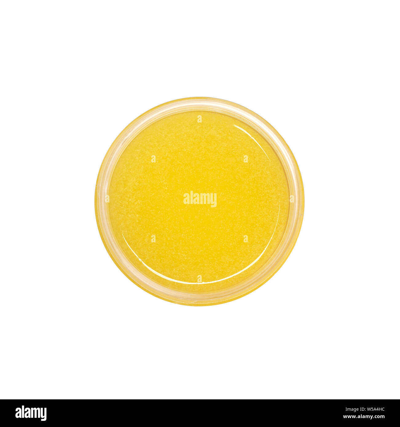 Gelbe Duschgel peeling Container auf weißem Hintergrund von oben Ansicht isoliert. Zuckerpaste. Stockfoto