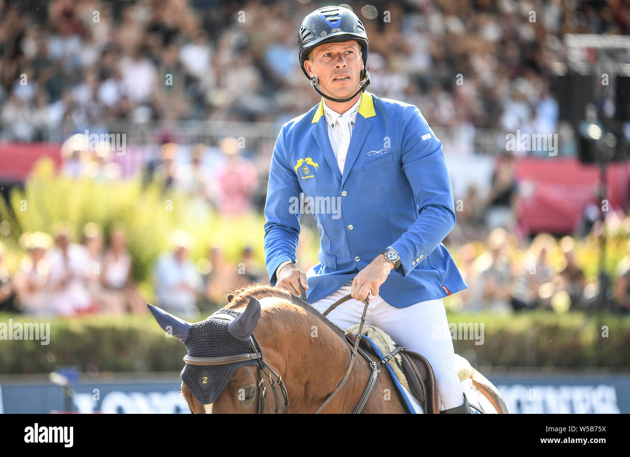 Berlin, Deutschland. 27. Juli, 2019. Reitsport/Springen: Global Champions Tour: Christian Ahlmann aus Deutschland reitet das Pferd nehmen eine Chance auf Mich Z an der Berliner Grand Prix. Quelle: Britta Pedersen/dpa-Zentralbild/dpa/Alamy leben Nachrichten Stockfoto