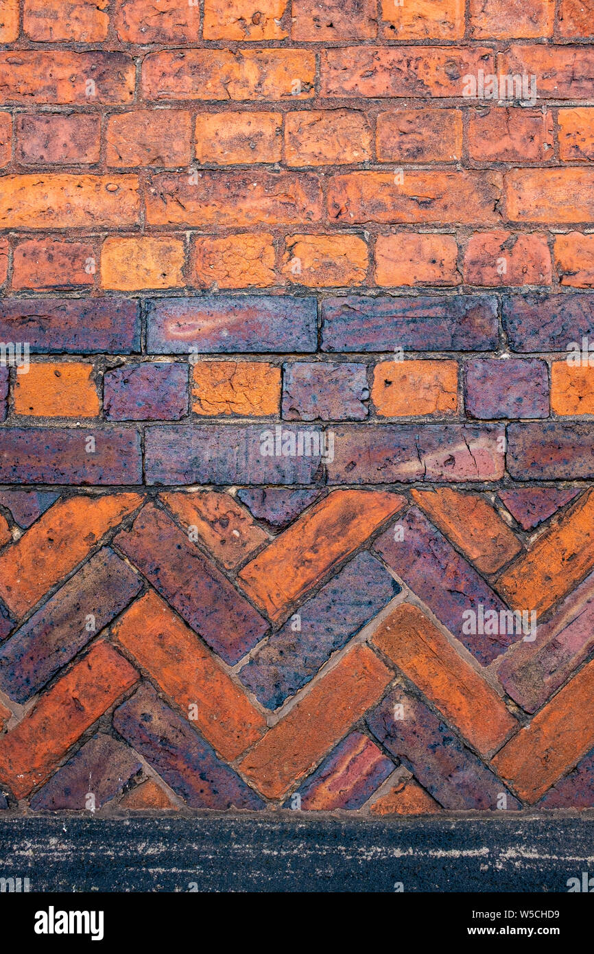 Nahaufnahme eines Red brick wall mit ungewöhnlich geformte Muster DE Stockfoto