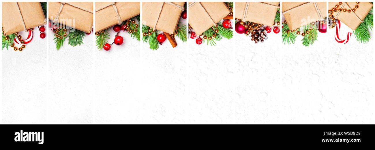 Viele Weihnachtsgeschenk. Zusammensetzung mit natürlichen Beige Handwerk Papier Geschenkboxen, Grüne Weihnachten tanne Zweig, rot Stechpalme Beeren und Kugeln auf weißem Stuck t Stockfoto