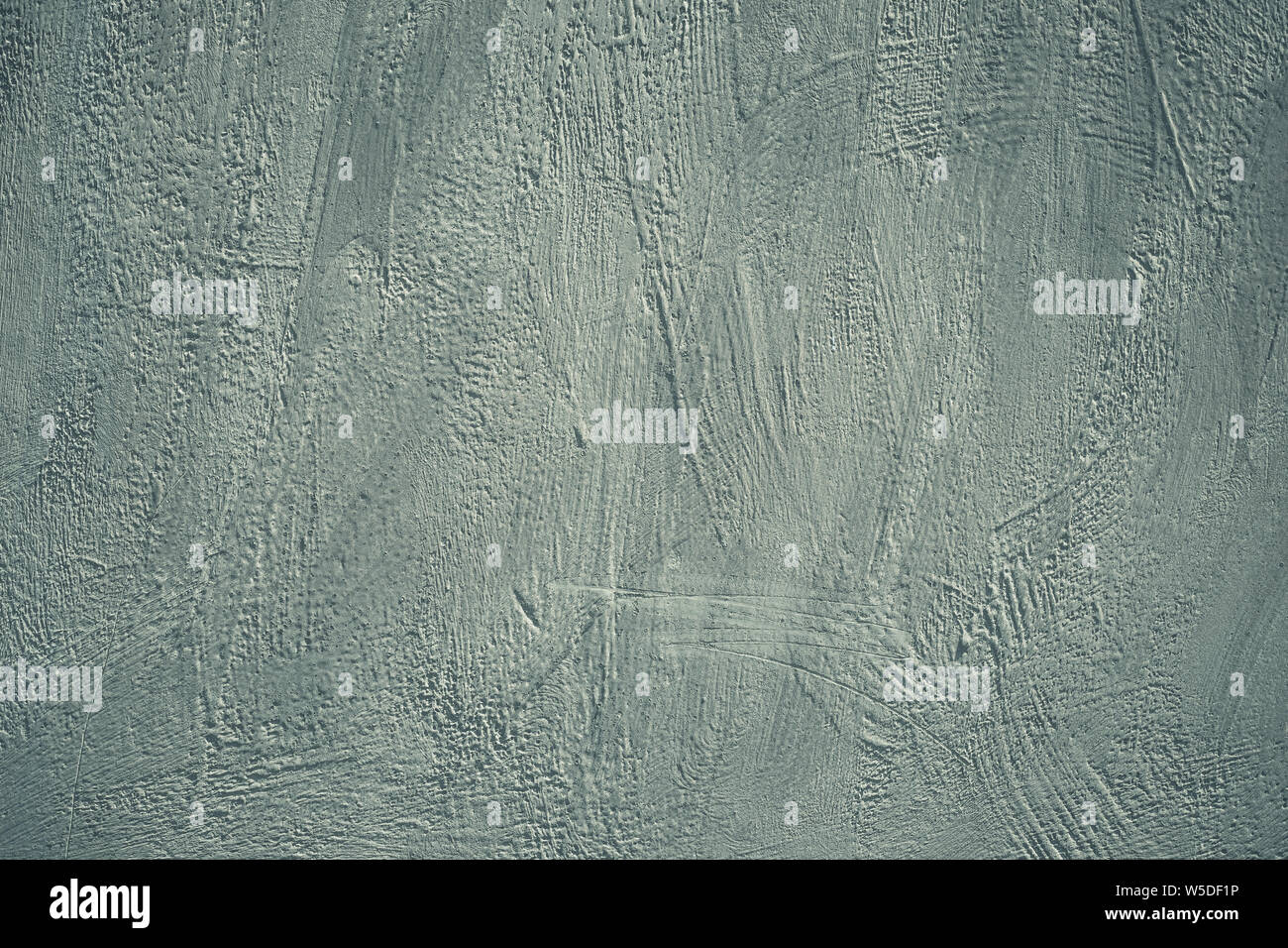 Grauer Hintergrund, grunge Betonwand. Grobe scabrous Textur. Dirty bemalte Wand. Acrylfarbe Muster auf Karte im modernen Stil. Verkratzte Oberfläche. C Stockfoto