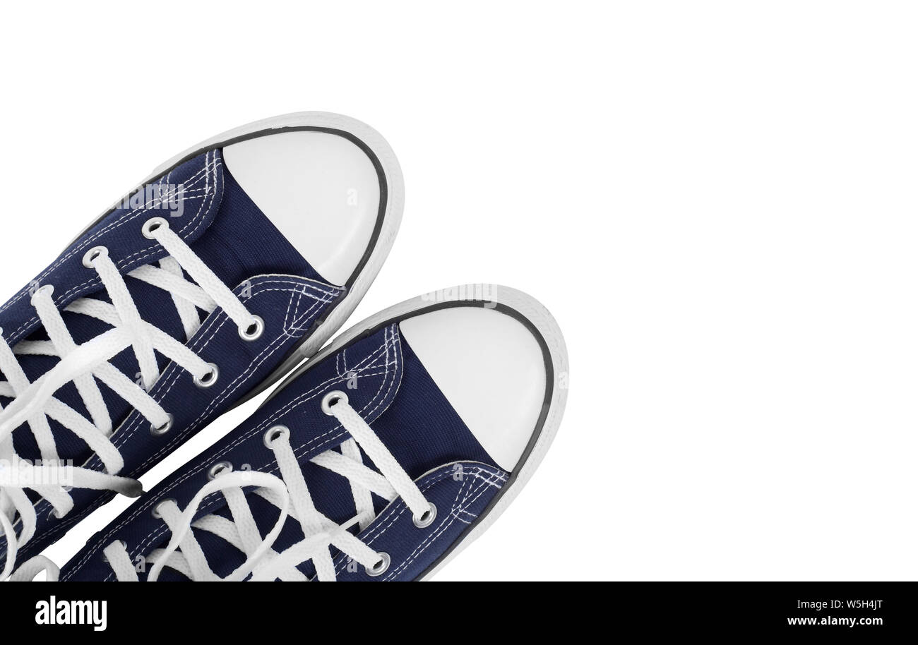 Bekleidung, Schuhe und Zubehör - Ansicht von oben Fragment closeup Paar blau gumshoes isoliert weißer Hintergrund Stockfoto