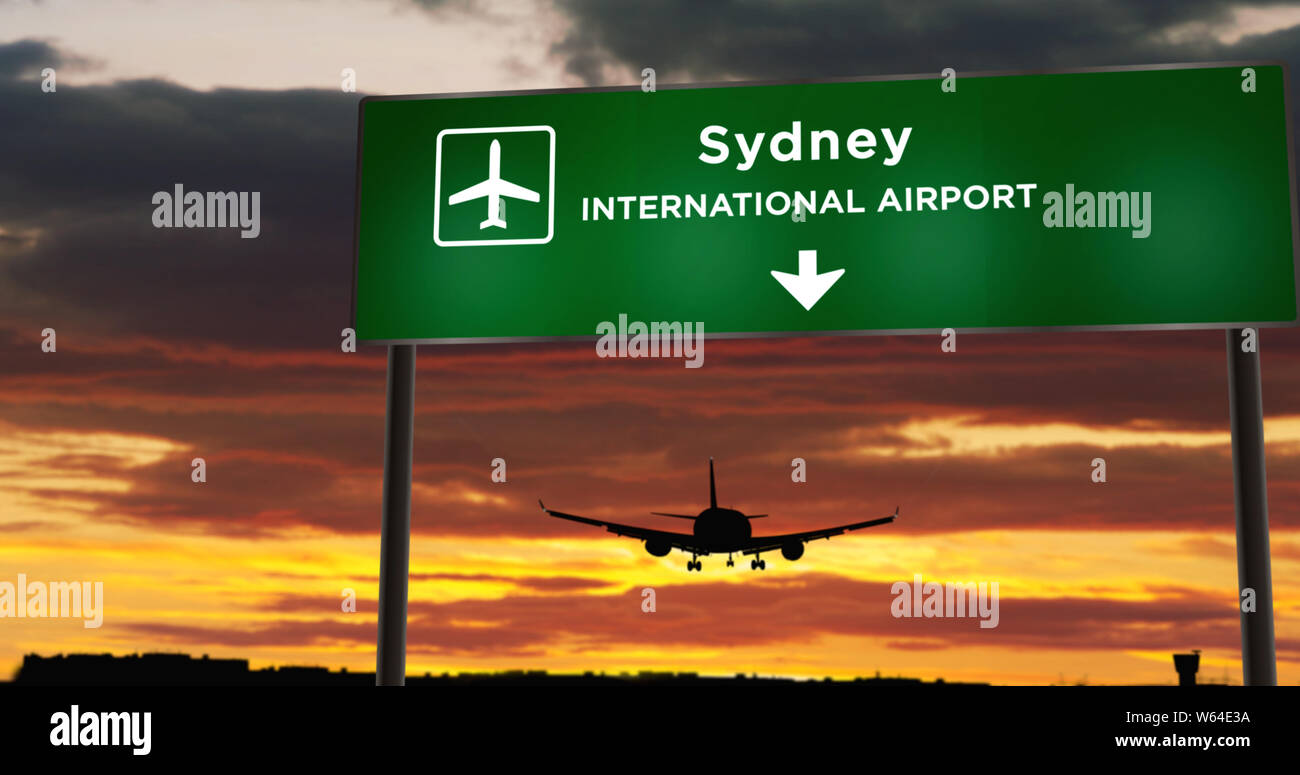 Flugzeug silhouette Landung in Sydney, Australien. Stadt Anreise mit Flughafen Richtung Namensschild und den Sonnenuntergang im Hintergrund. Reise und Transport conc Stockfoto