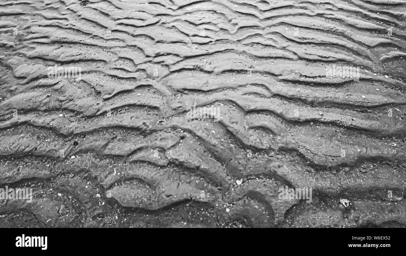 Abstrakte schwarz-weiß Textur Hintergrund. Sand am Meer Muster Textur. Wave line Textur Kunst Stockfoto