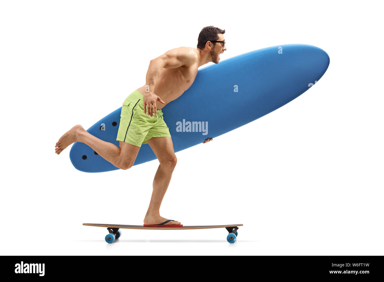 Junger Mann mit einem surboard Reiten ein Longboard Stockfoto