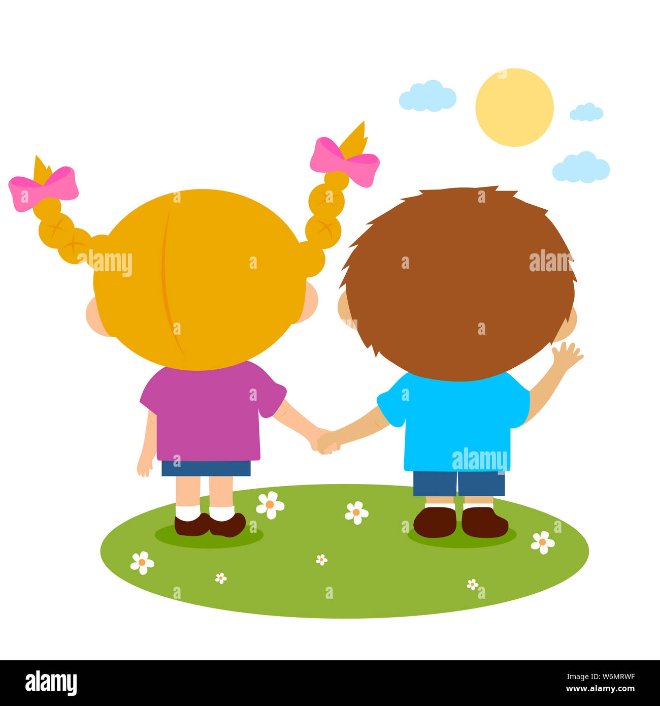 Ansicht der Rückseite ein Mädchen und ein Junge im Gras holdings Hände. Stockfoto