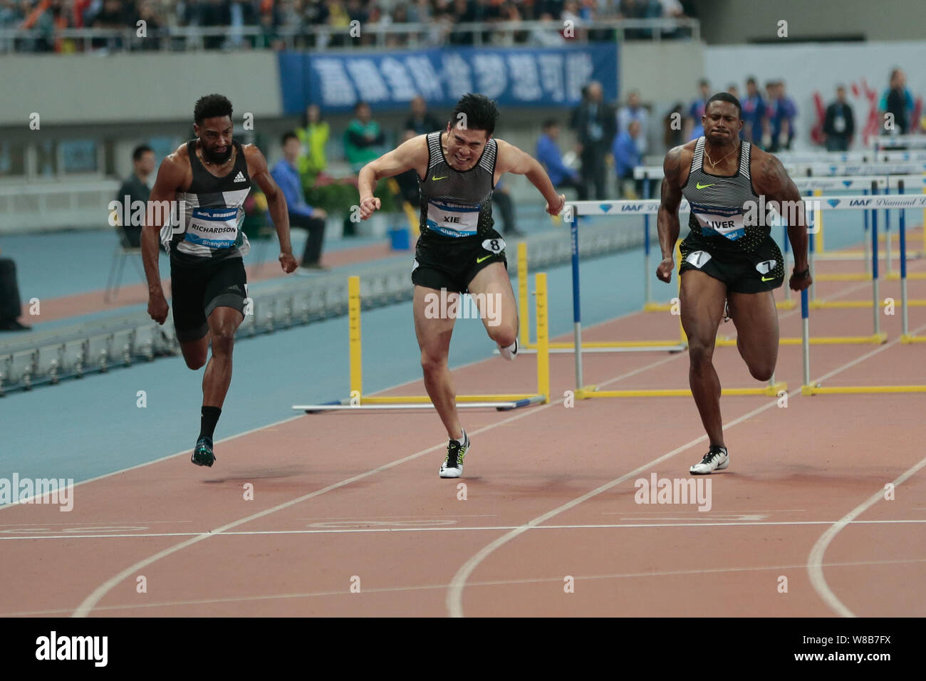 (Von links) Jason Richardson von der United States, Xie Wenjun von China und David Oliver der Vereinigten Staaten durch die Ziellinie in der Männer Stockfoto