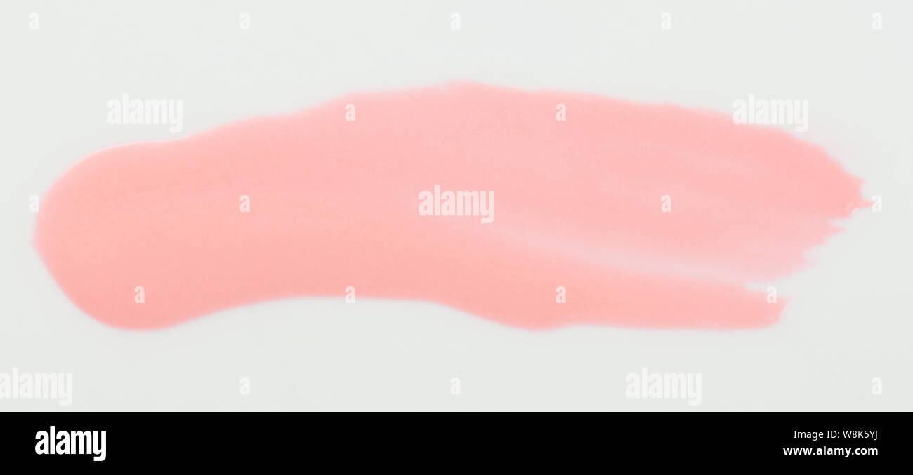 Glänzend rosafarbenen Strich auf weißem Hintergrund Nahaufnahme isoliert Stockfoto
