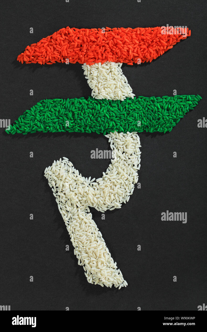 Indische Rupie-Symbol gemacht, der Reis und die indische Flagge Stockfoto