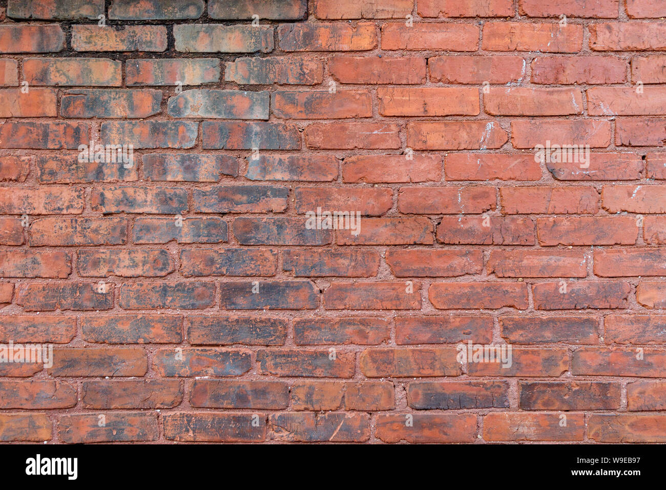 Old Red Brick Wall für den Hintergrund. Stockfoto