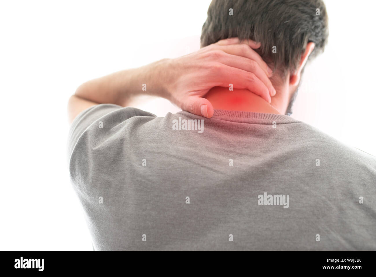 Rückansicht des Menschen leiden unter Nackenschmerzen Stockfoto