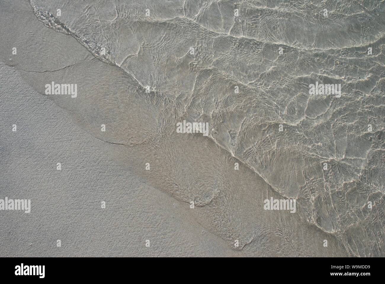Ankommenden Wellen auf Sand, Strand, Shetlandinseln, Schottland, UK Stockfoto