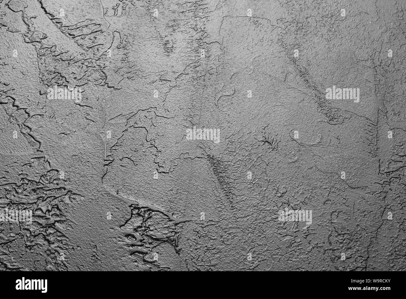 Schwarzer Hintergrund Wand mit Putty Stockfoto