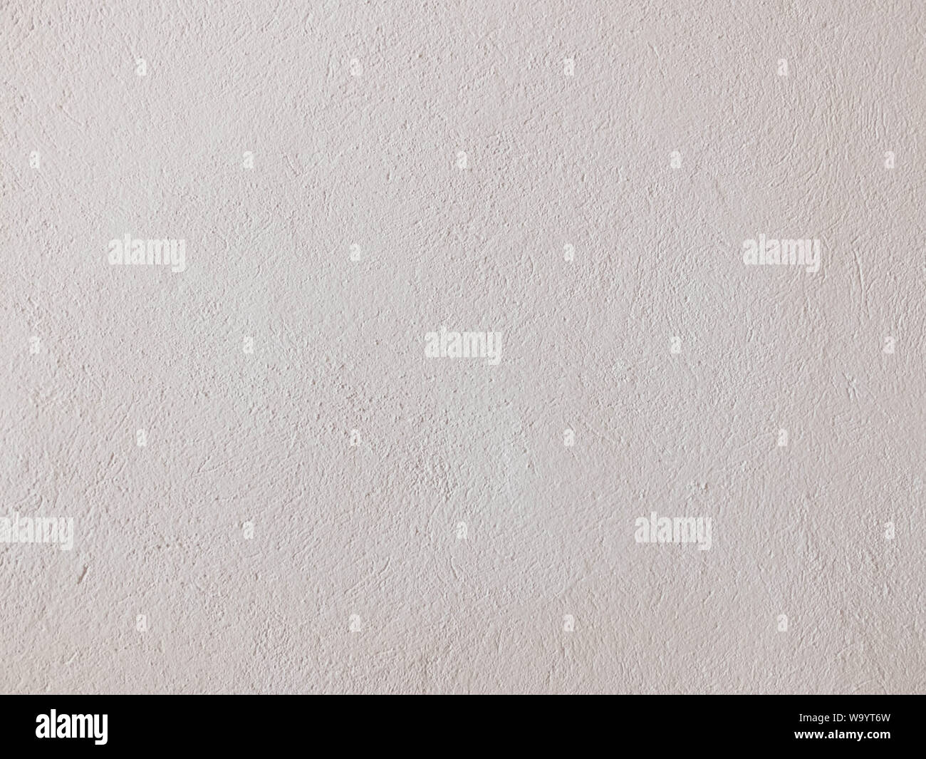 Texturierte gemahlenen Gips in hellem Beige. Hintergrund oder Textur nahtlose Muster. Stockfoto