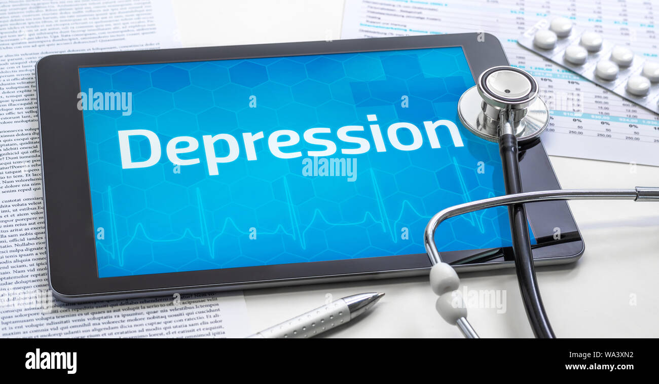 Das Wort Depression auf dem Display eines Tablet Stockfoto