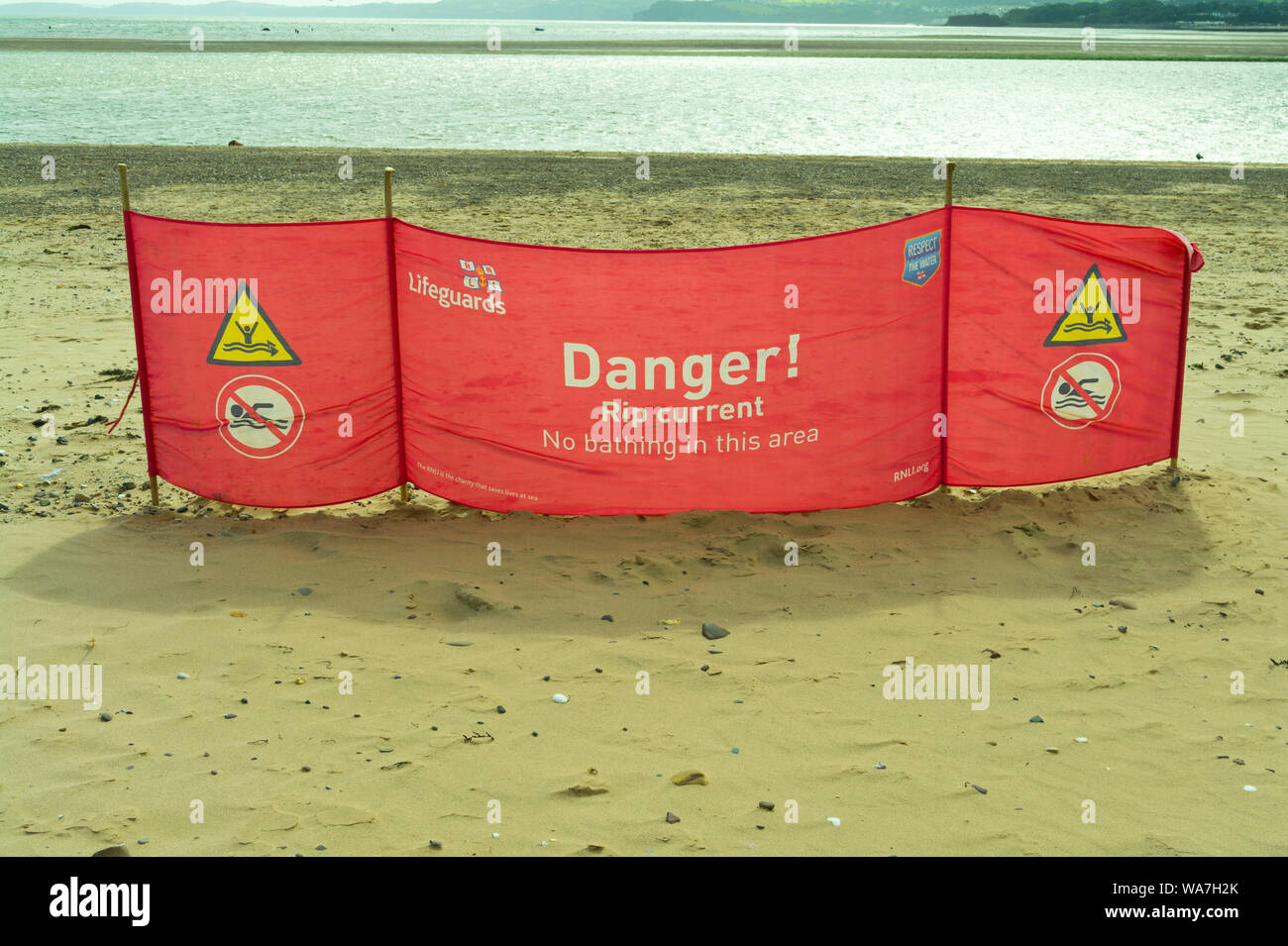 RNLI Lifeguards schild Warnung vor Gefahren durch Ströme zu rippen. Exmouth, Devon, Großbritannien Stockfoto