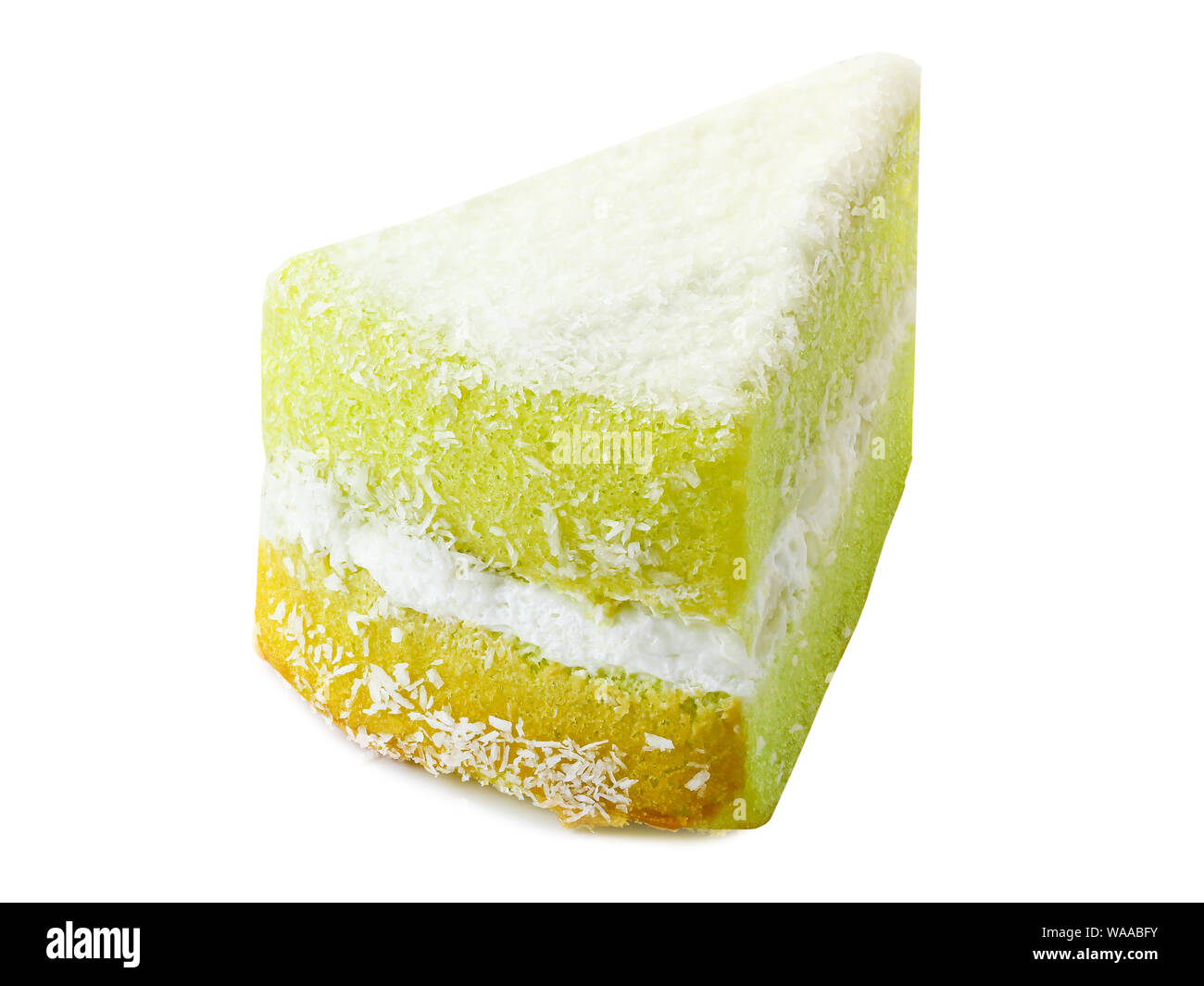 Süß grün Kuchen ist mit weißen Kokoscreme abgedeckt Stockfoto