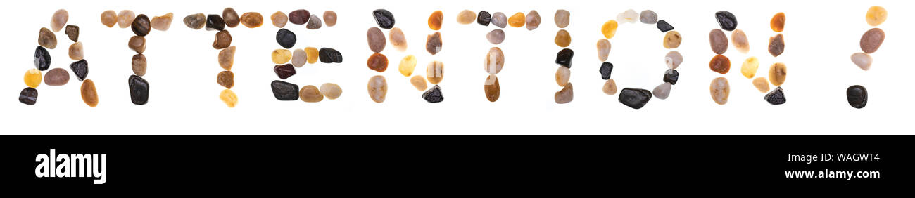 Wort ACHTUNG! Handgefertigt mit Steine (findlinge). Sammlung Wörter mit Steinen. Auf weissem Hintergrund Stockfoto