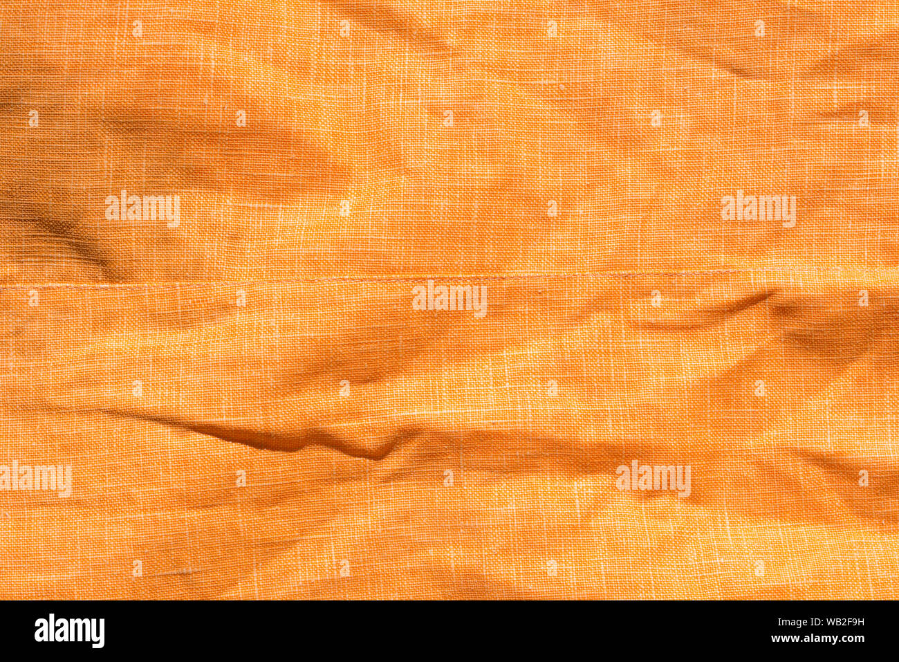 Zerknitterte Farbe orange background Textur Stockfoto