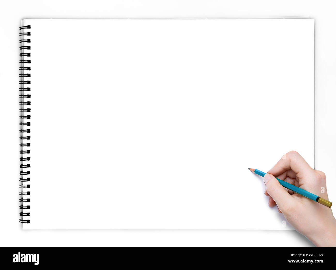 Hand mit Bleistift in weiß leerem Skizzenblock Buch Draufsicht. Stockfoto