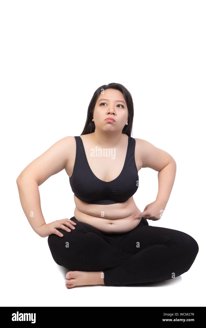 Fette Frau Punkt finger Bauch über Übergewicht auf weißem Hintergrund Stockfoto
