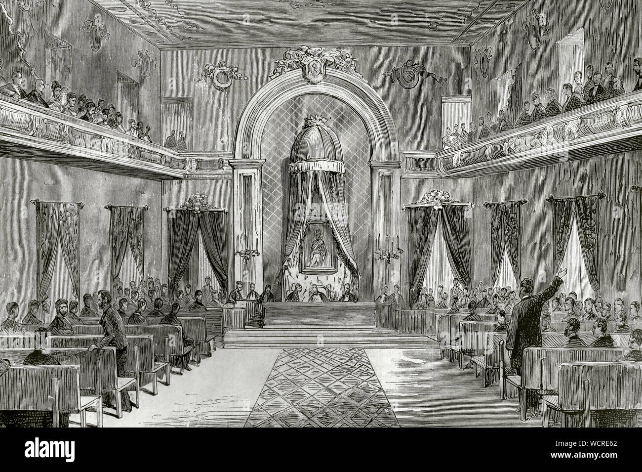 Spanien, Baskenland, Biskaya, Bilbao. Sitzung der Juntas Generales de Vizcaya (Parlament Foral von Biskaya). Sitzungen abgehalten wurden, zum ersten Mal in der Aula des Instituts in Bilbao. Das Gesetz wurde unter Vorsitz von einem Porträt von König Alfonso XII. Die letzte Sitzung fand am Abend des 7. Oktober 1876 statt. Zuvor diese Sitzungen abgehalten wurden, je nach Zuständigkeit, im Baum der Guernica (Gernika). Am Ende der Karlistenkriege in 1876, die Juntas Generales wurden zusammen mit dem Rest der chartered Regime abgeschafft. Gravur. La Ilustracion Española y Americana, 22. Oktober, 18. Stockfoto