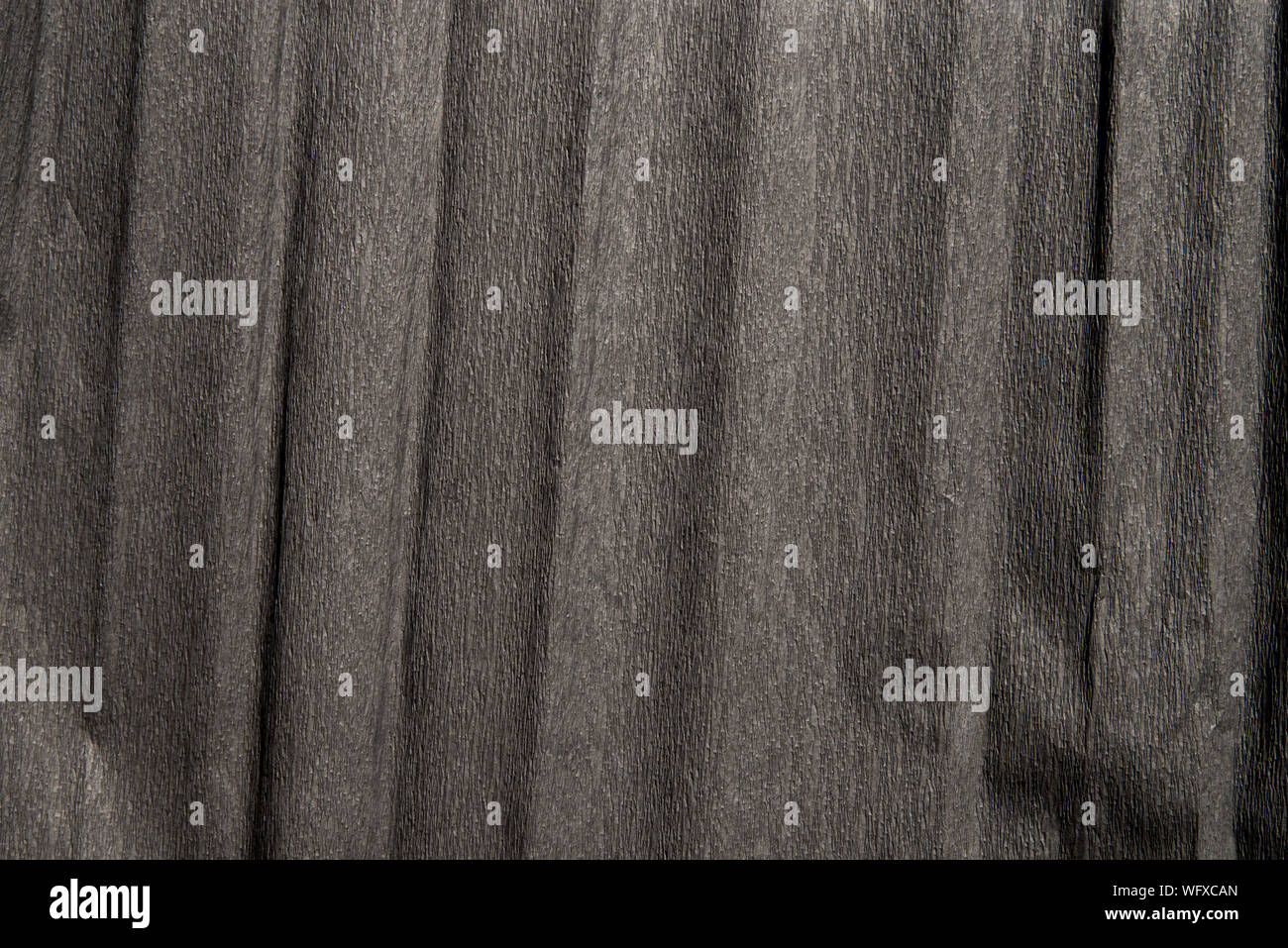 Schwarze Farbe gefaltetes Papier Textur Hintergrund Stockfoto