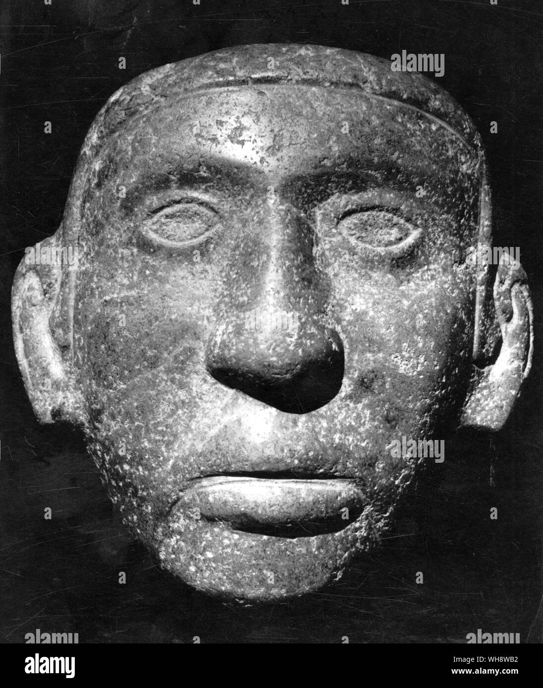 Eine steinerne Skulptur von einer aztekischen Kopf - Rennen, das seine Herrschaft über alle Völker von Mexiko verhängt Stockfoto