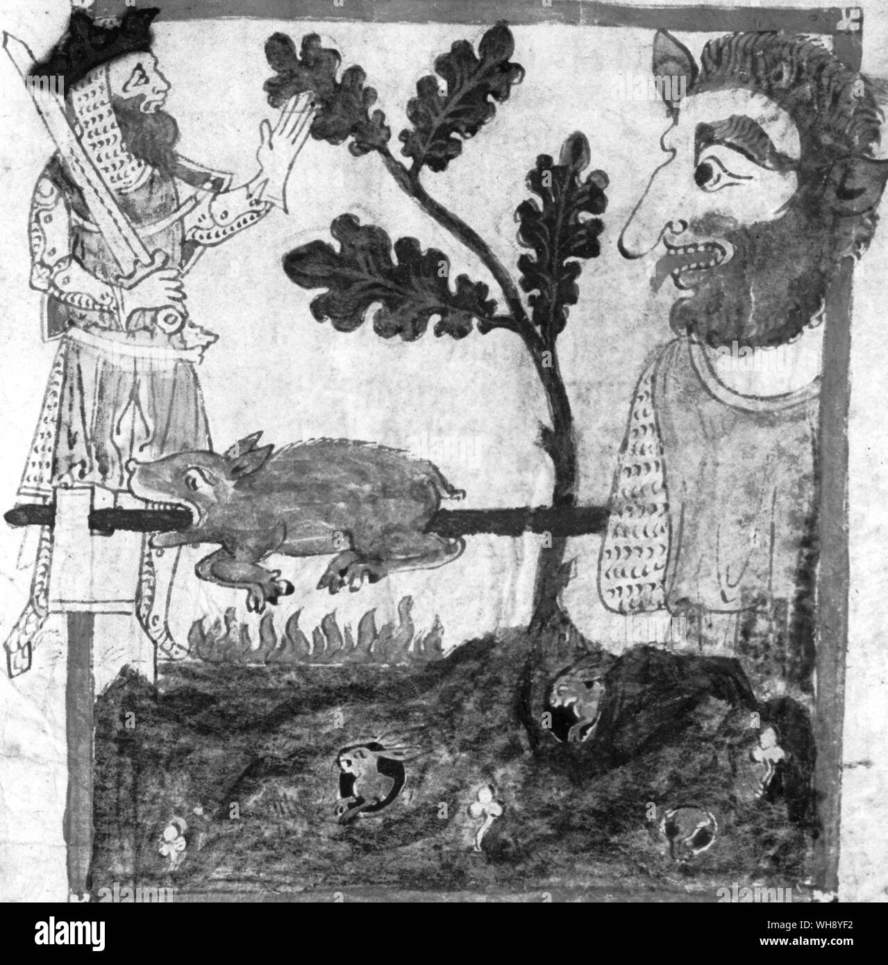 King Arthur, Schwert in der Hand vor einer riesigen Rösten ein Schwein auf dem Mount St. Michael Stockfoto