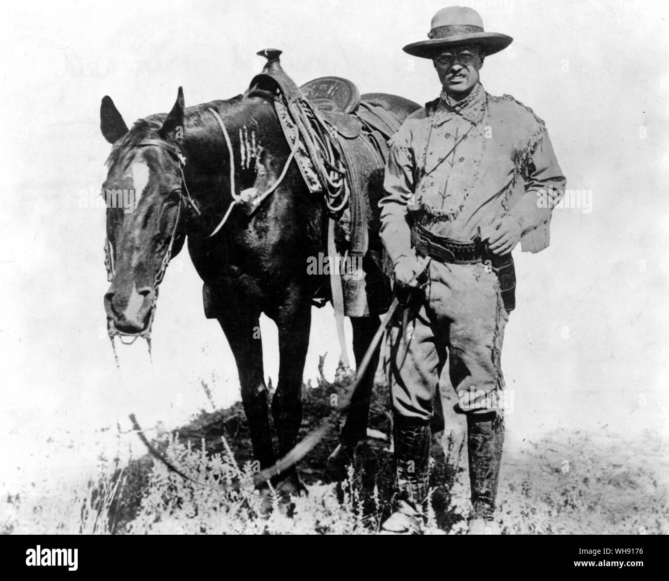 Theodore Roosevelt posiert mit einem Pferd. Teddy in der Realität. Stockfoto