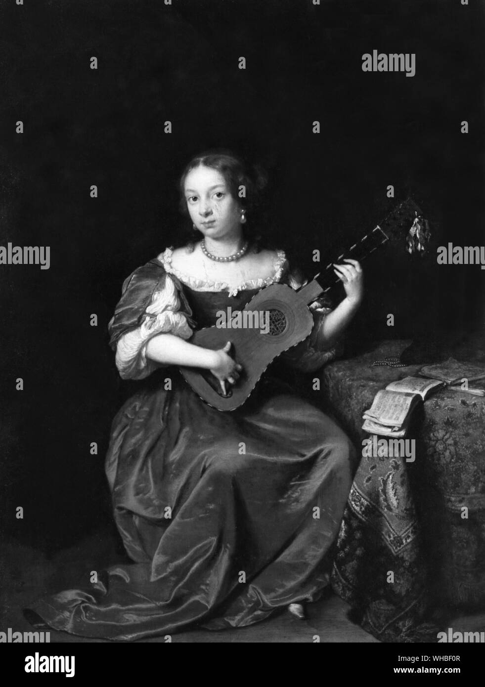 Dame spielt die Gitarre von Caspar Netscher Stockfoto