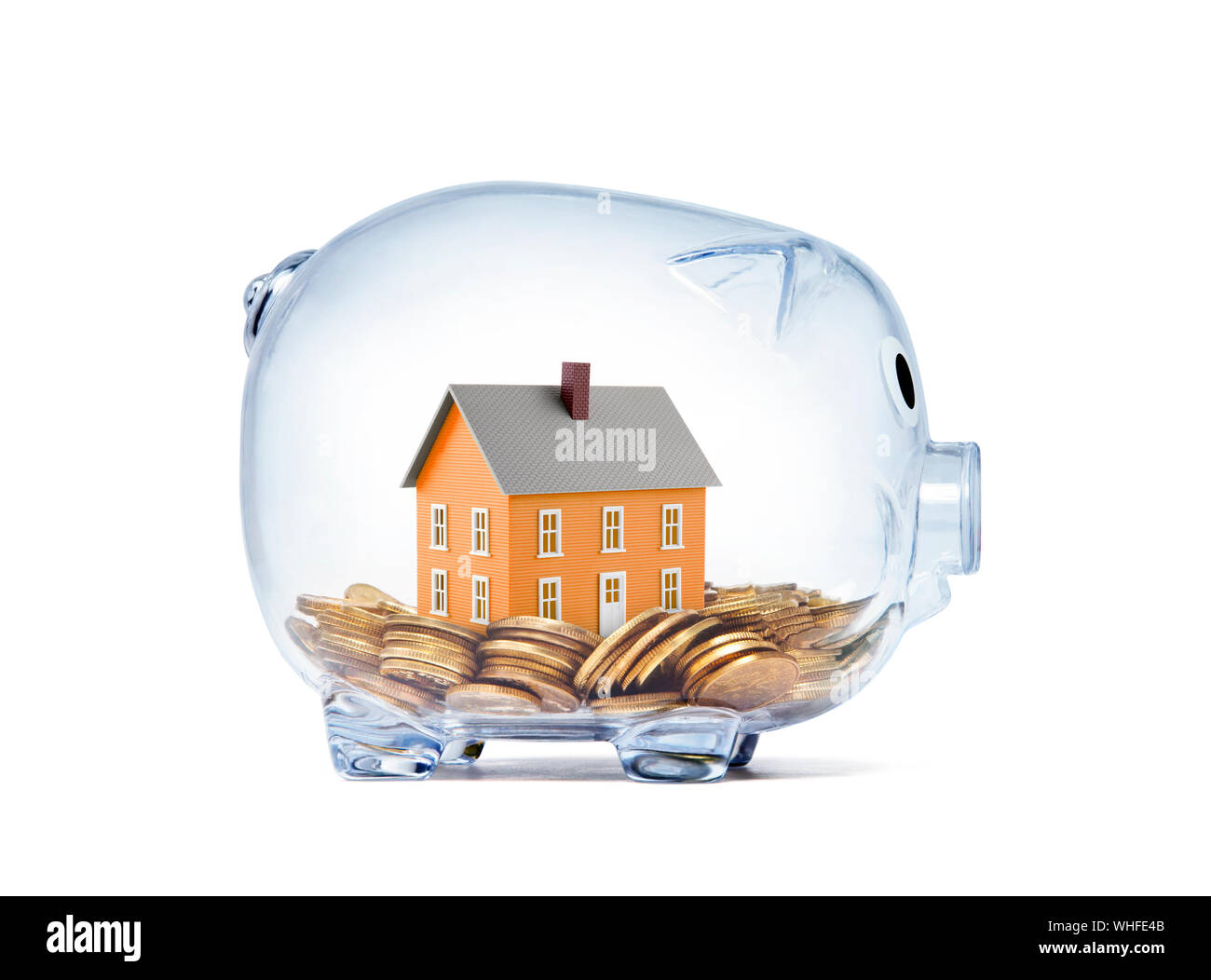 Orange House auf Geld innen transparent Sparschwein mit Freistellungspfad Stockfoto
