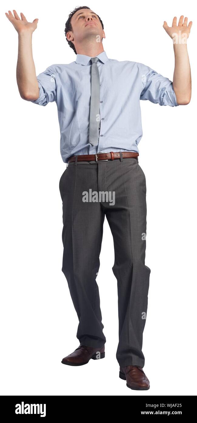 Geschäftsmann, posiert mit erhobenen Armen Stockfoto