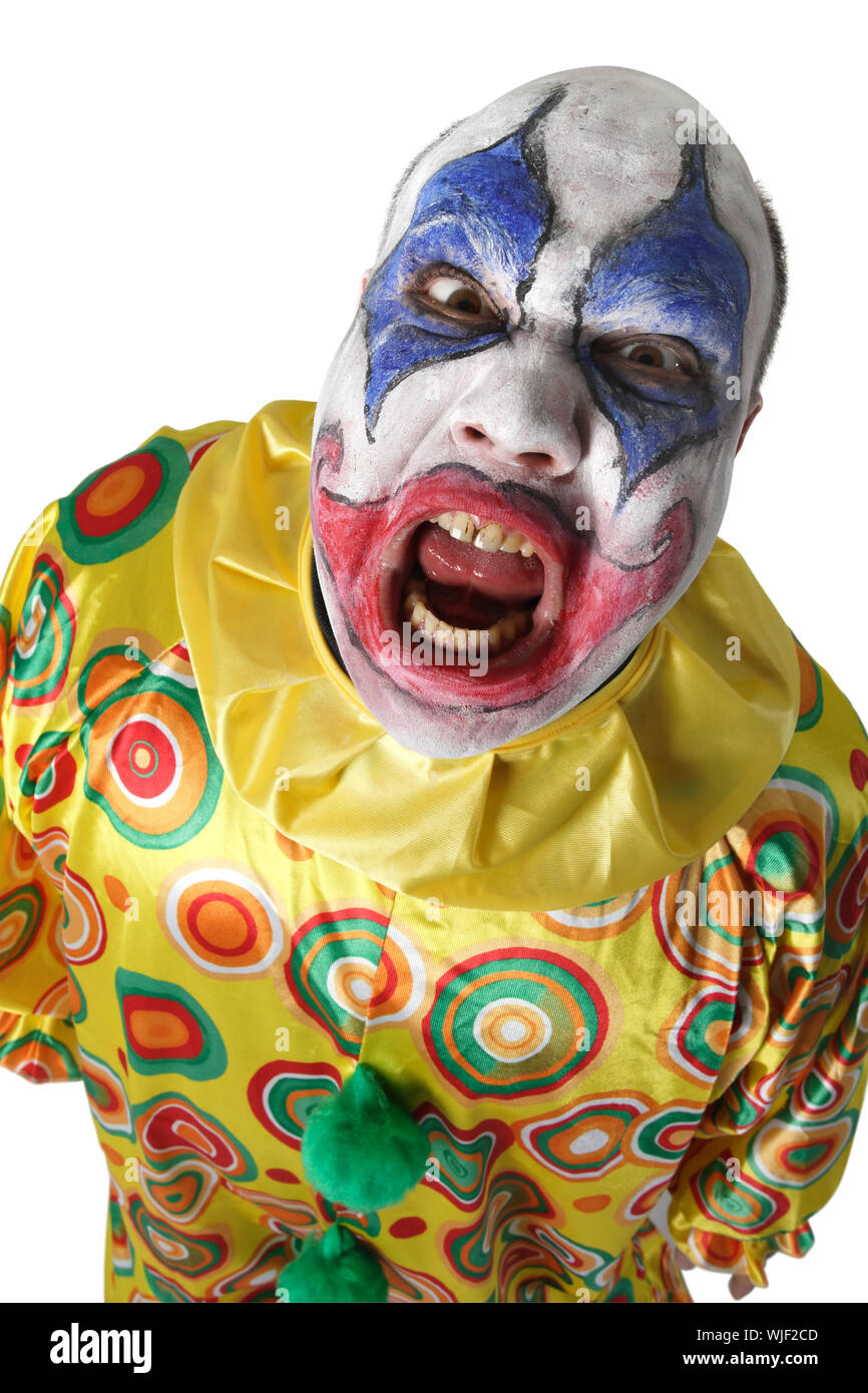 Einen bösen bösen Clown, wütend und suchen. Grelle Beleuchtung von unten. Stockfoto