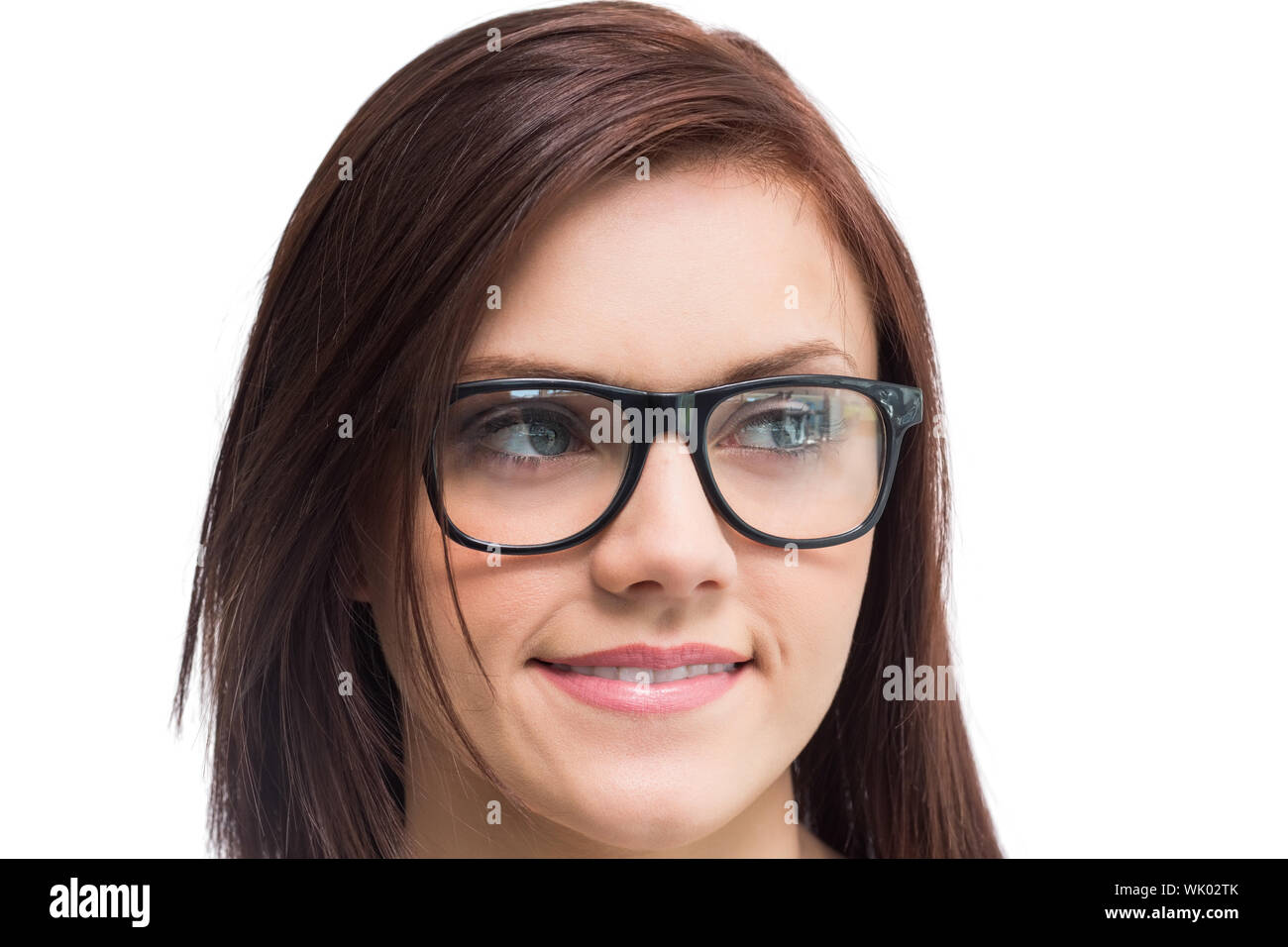 Fröhliche junge Frau mit Brille posiert Stockfoto
