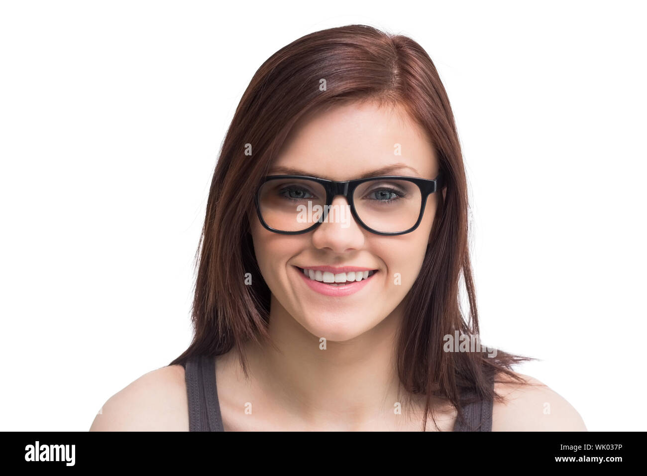 Hübsche junge Frau mit Brille posiert Stockfoto