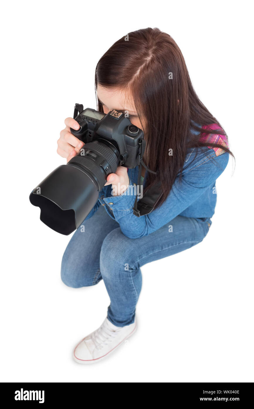 Vogelperspektive Blick auf lässige junge Fotografin unter Bild Stockfoto