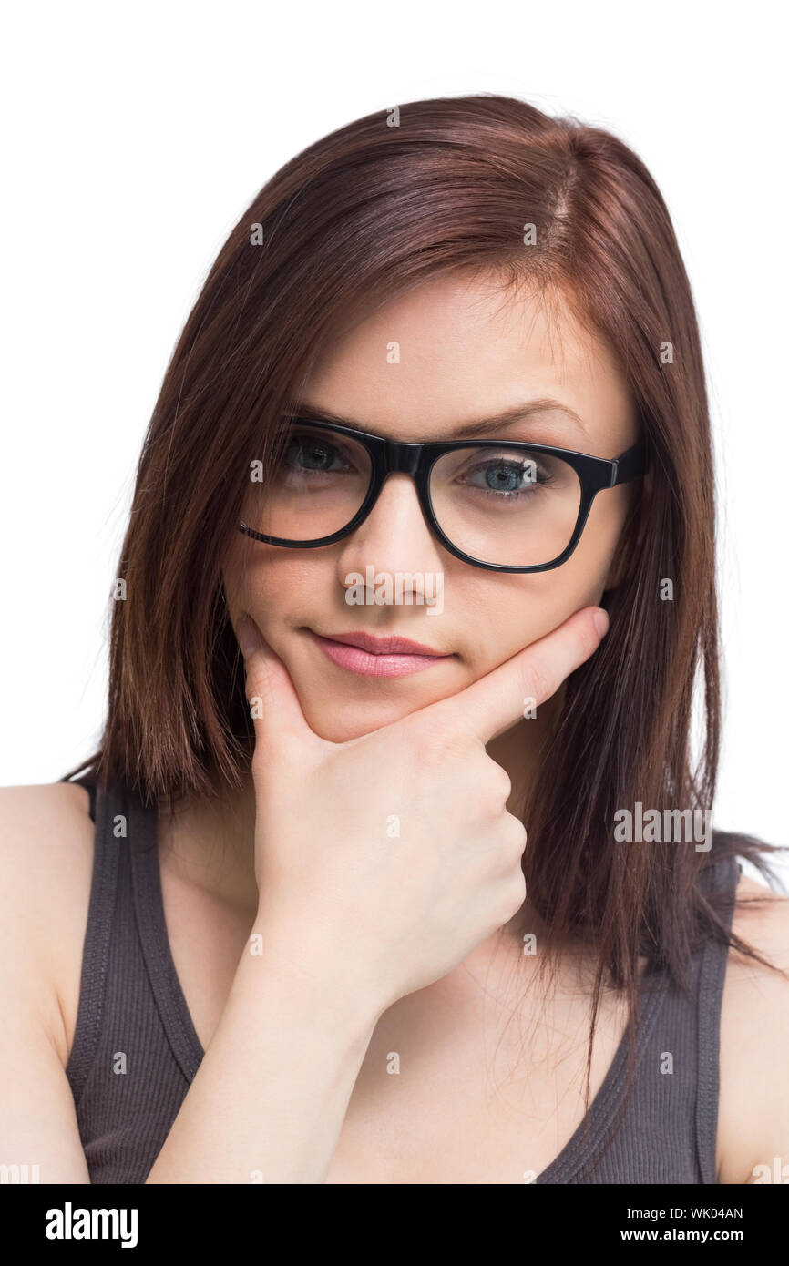 Junge Frau mit Brille posiert denken Stockfoto