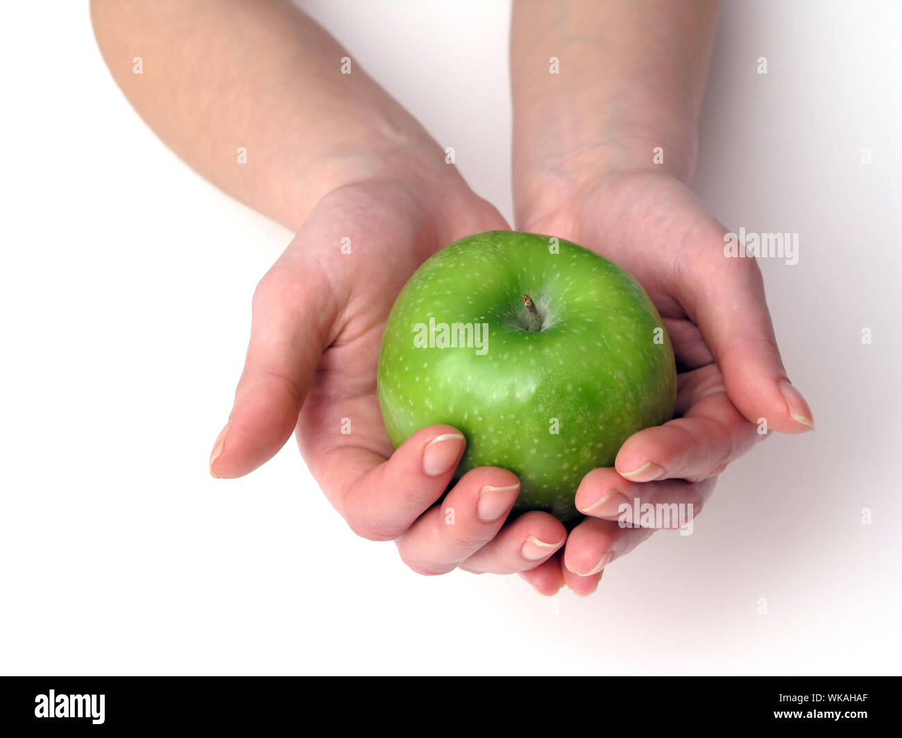 Apfel in der hand Stockfoto