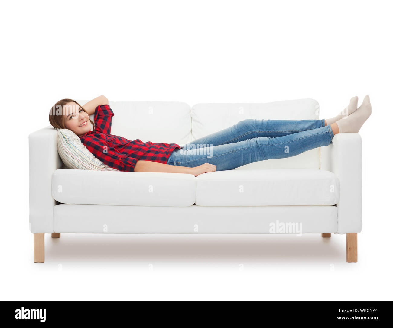 Teenage girl lying on couch Ausgeschnittene Stockfotos und -bilder - Alamy