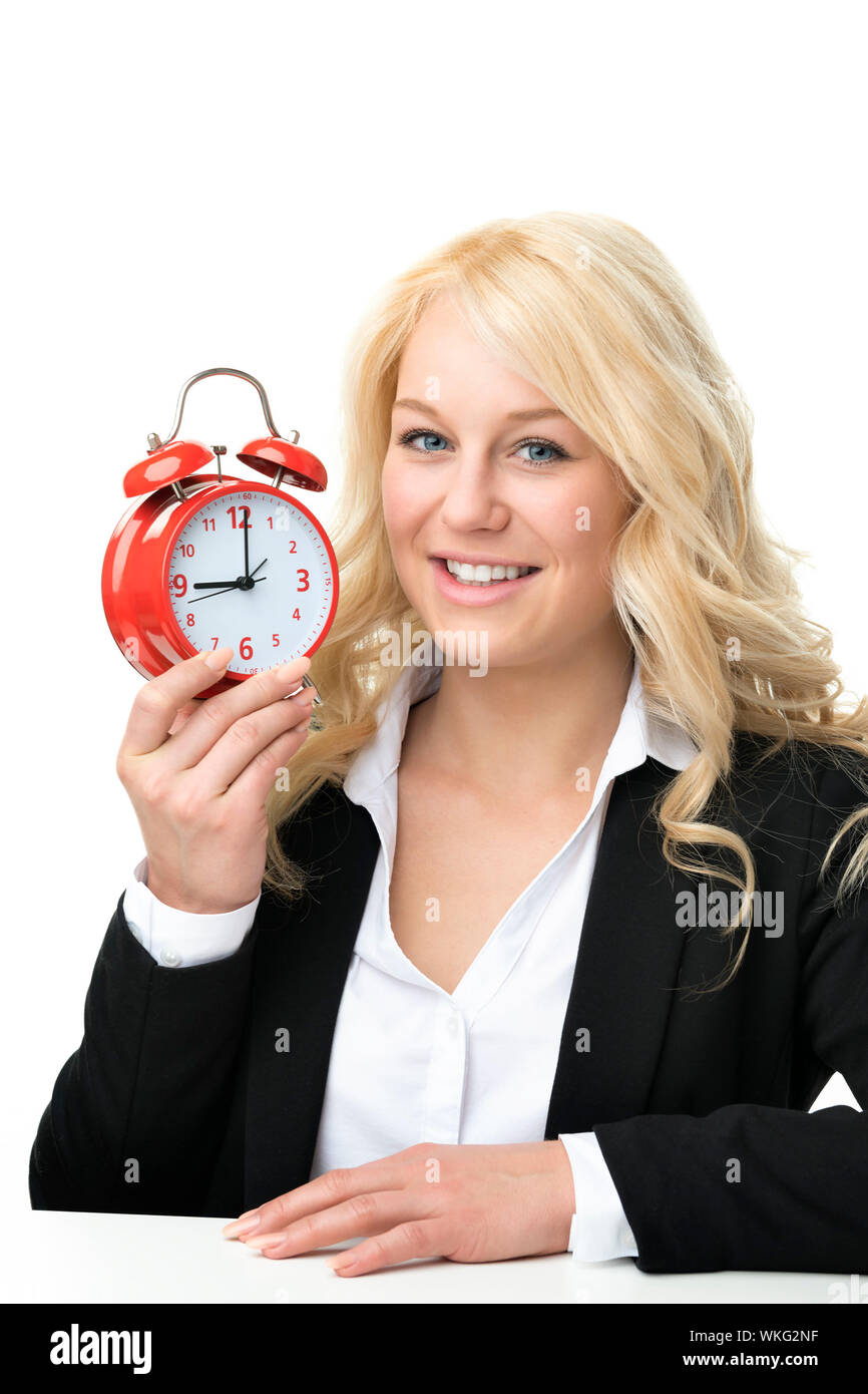 Blonde Frau mit roten Wecker lachen Stockfoto